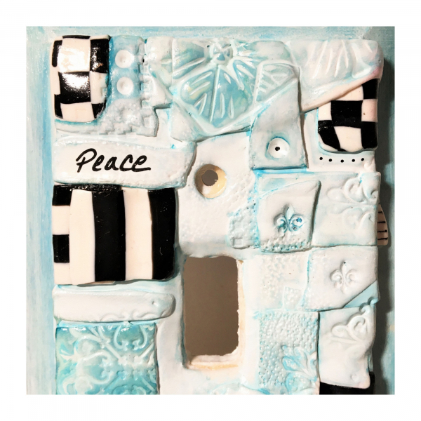 Retro Turquoise Black and White Peace Plate. Sculpted clay and inks on wood Swit
